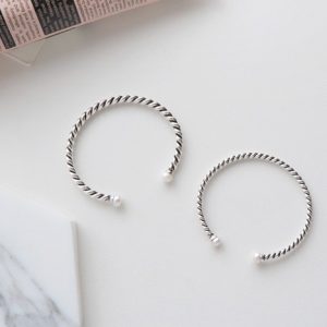 TWISTED SILVER BANGLE WITH FAUX PEARLS