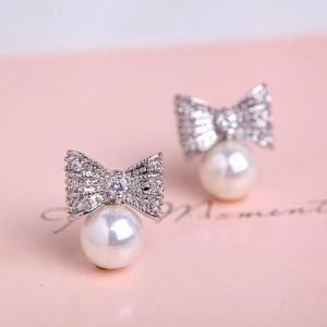 PEARL AND BOW STUD EARRINGS